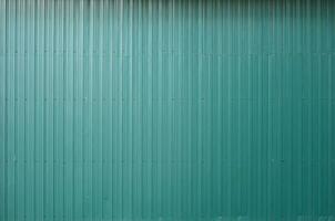 Siding metal vertical panels texture closeup in the daytime outdoors photo