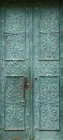 Old ancient metal door texture in european medieval style photo