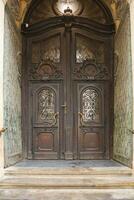 Old ancient wooden door texture in european medieval style photo