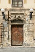 Old ancient wooden door texture in european medieval style photo