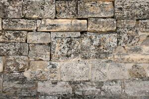 Texture of stone wall with many big brown stones photo