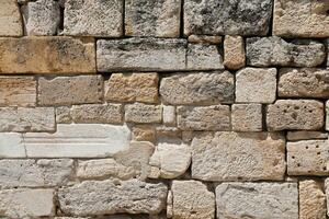 Texture of stone wall with many big brown stones photo