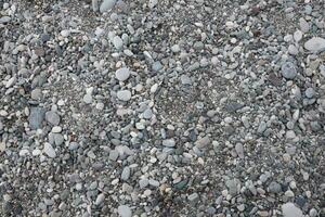 Texture of pebbles from the sea shore bank beach photo