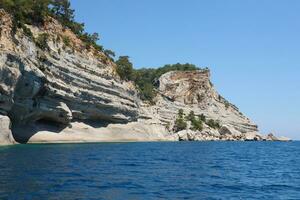 Landscape of Turkey natural rock mountains over blue sea water photo