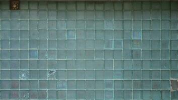 Glass blocks wall texture with small factory vent photo