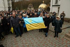 TERNOPIL, UKRAINE - APRIL 2, 2023 People with flag during mission in complex of Ukrainian Jerusalem in the Mari spiritual center of Zarvanytsia In the Terebovlya district of the Ternopil photo