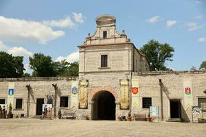 TERNOPIL, UKRAINE - AUGUST 23, 2023 Main building of palace and inner yard of medieval Zbarazh Castle in Zbarazh town of Ternopil region photo