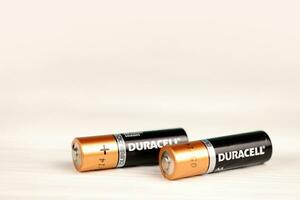 Duracell batteries on white background. Duracell is an American brand of batteries and smart power solutions manufactured by Procter and Gamble photo