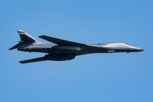 Strategic bomber plane at air base. Air force and army. Airport and airfield. Military aircraft. Aviation industry. photo