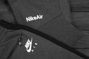 KHARKOV, UKRAINE - DECEMBER 20, 2020 Nike brand clothes sport wear kit. Nike is American multinational corporation engaged in manufacturing and worldwide marketing of clothes and footwear photo