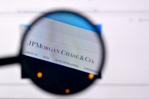 Homepage of jp morgan chase website on the display of PC, url - jpmorganchase.com. photo