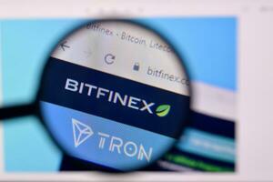Homepage of bitfinex website on the display of PC, url - bitfinex.com. photo