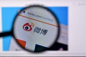 Homepage of weibo website on the display of PC, url - weibo.com. photo