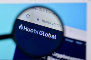 Homepage of huobi website on the display of PC, url - huobi.com. photo