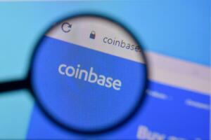 Homepage of coinbase website on the display of PC, url - coinbase.com. photo