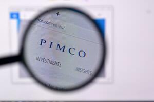Homepage of pimco website on the display of PC, url - pimco.com. photo