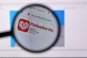 Homepage of pinduoduo website on the display of PC, url - pinduoduo.com. photo
