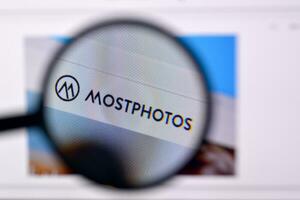 Homepage of mostphotos website on the display of PC, url - mostphotos.com. photo