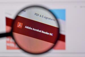 Web page of adobe acrobat reader product on official website on the display of PC photo