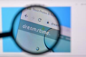 Homepage of dreamstime website on the display of PC, url - dreamstime.com. photo