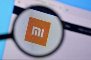 Homepage of xiaomi website on the display of PC, url - mi.com. photo