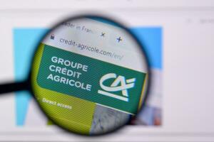 Homepage of credit-agricole website on the display of PC, url - credit-agricole.com. photo
