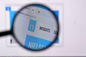 Homepage of nielsen website on the display of PC, url - nielsen.com. photo