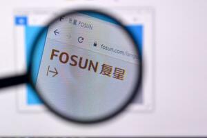 Homepage of fosun website on the display of PC, url - fosun.com. photo