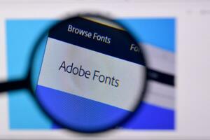 Web page of adobe fonts product on official website on the display of PC photo