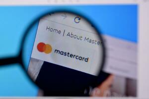 Homepage of mastercard website on the display of PC, url - mastercard.com. photo