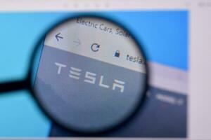 Homepage of tesla website on the display of PC, url - tesla.com. photo