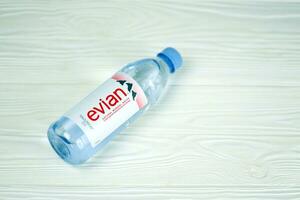 KHARKOV, UKRAINE - JULY 2, 2021 Bottle Of Evian Natural Mineral Water. Evian bottling factory located in Amphion, France photo