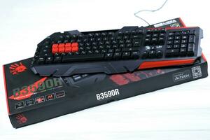 KHARKOV, UKRAINE - MARCH 14, 2021 A4tech bloody series B3590R gaming keyboard for cybersports and e-sports with key dominator support photo