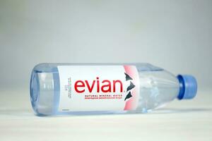 KHARKOV, UKRAINE - JULY 2, 2021 Bottle Of Evian Natural Mineral Water. Evian bottling factory located in Amphion, France photo