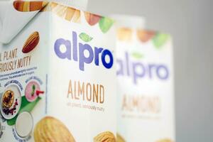 KHARKOV, UKRAINE - JULY 2, 2020 Alpro almond and hazelnut milk packs produced by European company from Wevelgem, Belgium photo