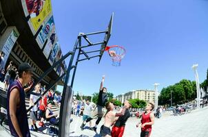 KHARKIV, UKRAINE - 27 MAY, 2018 Sports teams play streetball in the open air during the annual festival of street cultures photo