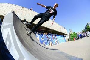 KHARKIV, UKRAINE - 27 MAY, 2018 Skateboarding contest in outdoors skate park during the annual festival of street cultures photo