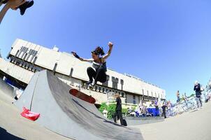 KHARKIV, UKRAINE - 27 MAY, 2018 Skateboarding contest in outdoors skate park during the annual festival of street cultures photo