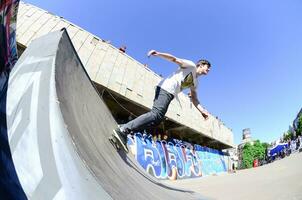 KHARKIV, UKRAINE - 27 MAY, 2018 Skateboarding contest in outdoors skate park during the annual festival of street cultures photo