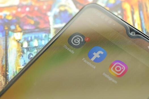 KYIV, UKRAINE - JULY 7, 2023 Threads by Meta application on display of Samsung smartphone lying on table photo