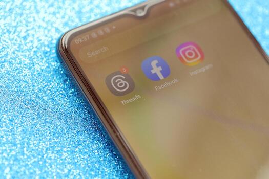 KYIV, UKRAINE - JULY 7, 2023 Threads by Meta application on display of Samsung smartphone lying on table photo