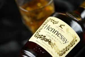 KYIV, UKRAINE - MAY 4, 2022 Hennessy Very Special original alcohol bottle on black wooden table photo