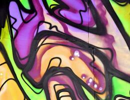 Colorful background of graffiti painting artwork with bright aerosol strips and beautiful colors photo