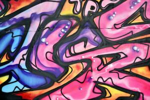 Colorful background of graffiti painting artwork with bright aerosol strips and beautiful colors photo