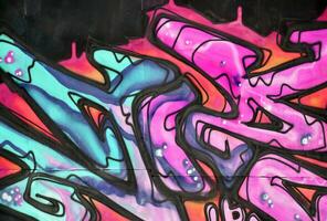 Colorful background of graffiti painting artwork with bright aerosol strips and beautiful colors photo