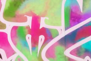 Colorful background of graffiti painting artwork with bright aerosol strips on metal wall photo