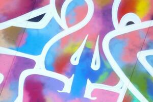 Colorful background of graffiti painting artwork with bright aerosol strips on metal wall photo