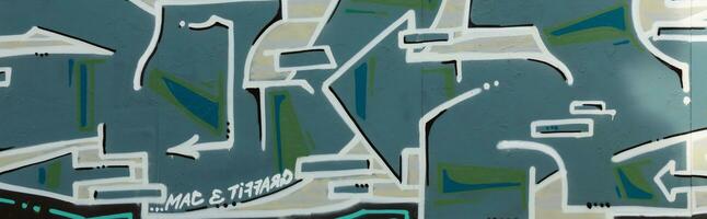 Colorful background of graffiti painting artwork with bright aerosol strips on metal wall photo