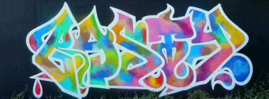 Colorful background of graffiti painting artwork with bright aerosol strips on metal wall photo