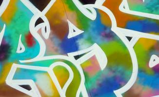 Colorful background of graffiti painting artwork with bright aerosol strips on metal wall photo